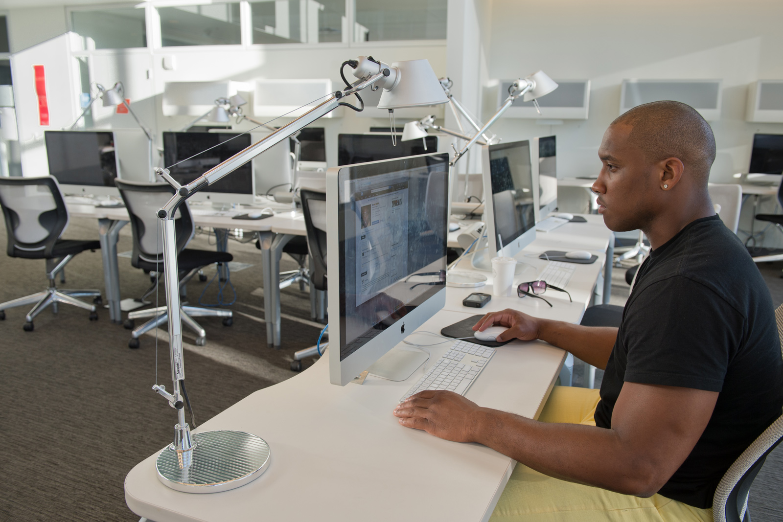 Student in front of computer in computer lab